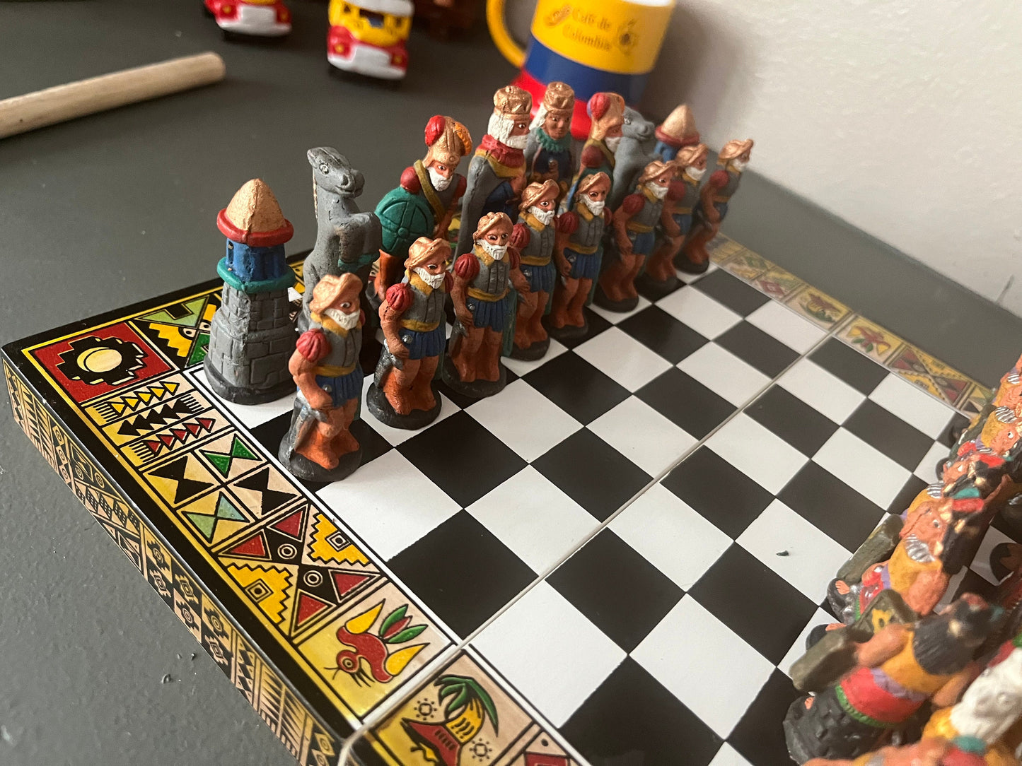 Colombian chess. Carved in wood figures. Colonization representation