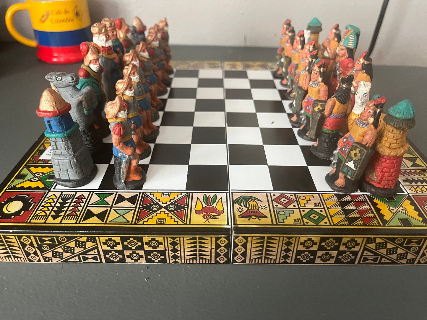 Colombian chess. Carved in wood figures. Colonization representation
