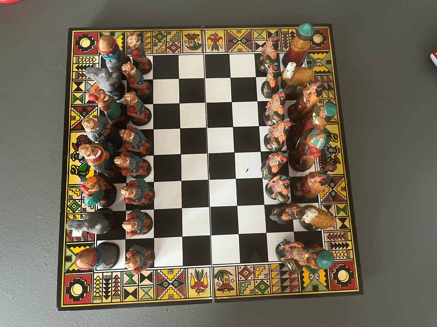 Colombian chess. Carved in wood figures. Colonization representation